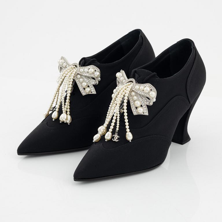 Chanel, a pair of pearl and strass bow pumps, size 37.