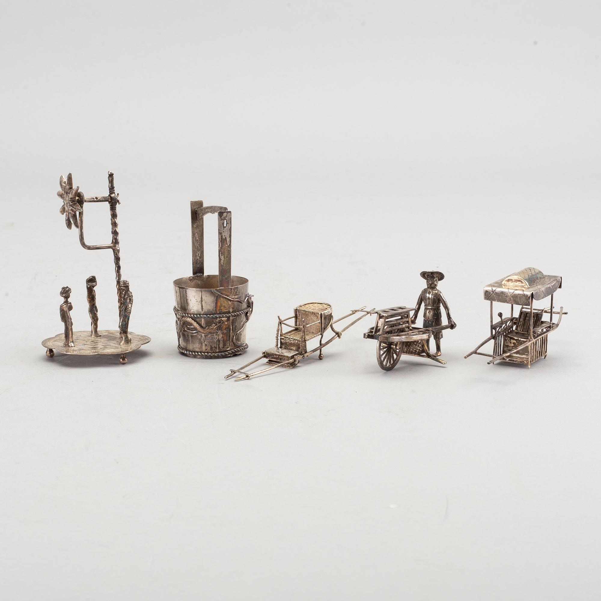 A set of five Chinese silver figurines.
