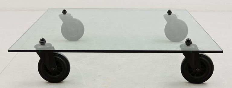 A Gae Aulenti 'Tavola con Ruote' table, Fontana Arte, Italy.