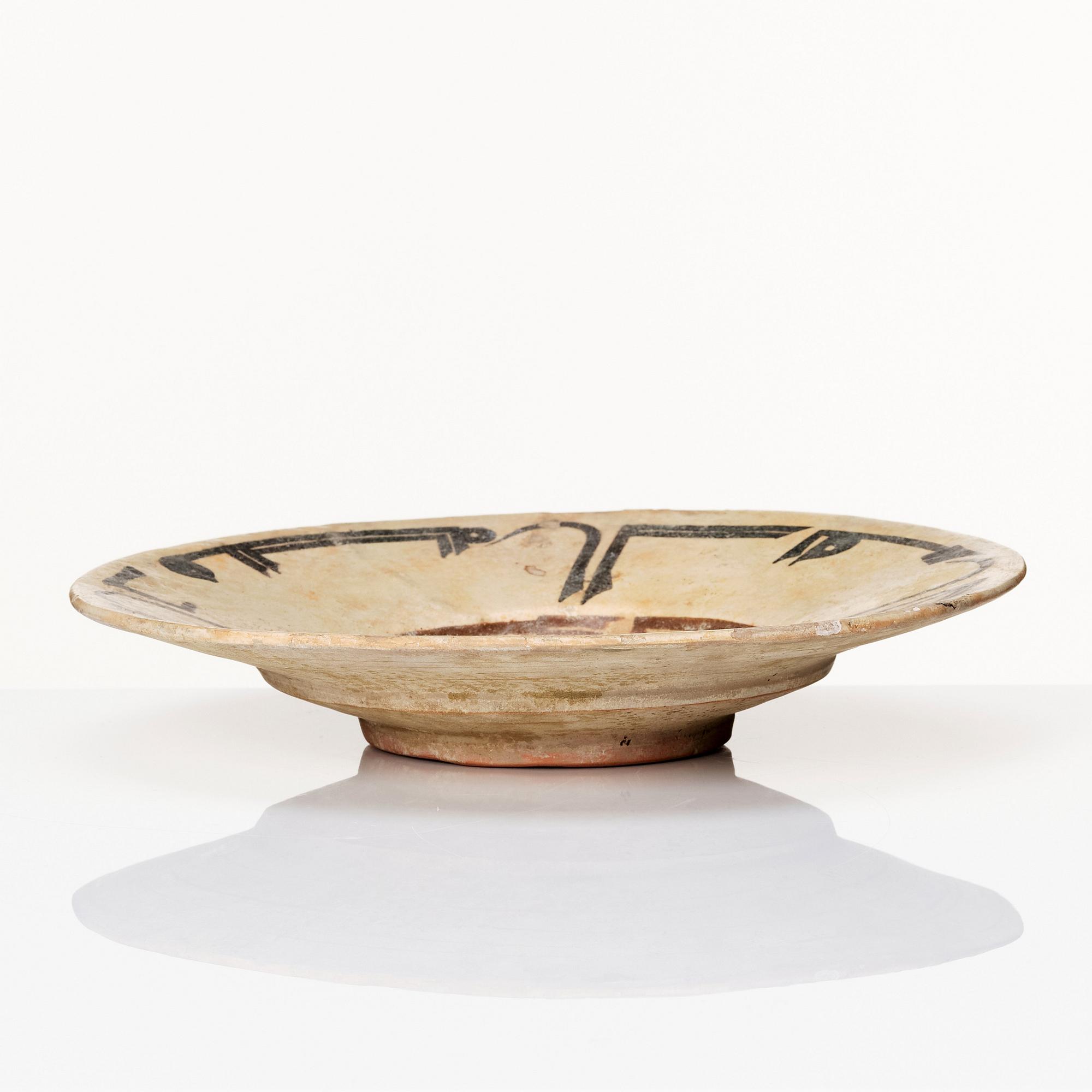 A Nishapur calligraphy dish, eastern Iran, 10th century.