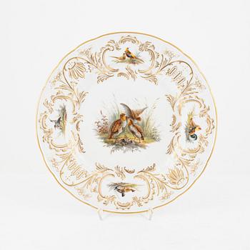 A set of five Meissen porcelain games plates, late 19th to early 20th century.