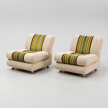 A pair of 1970s easy chairs.