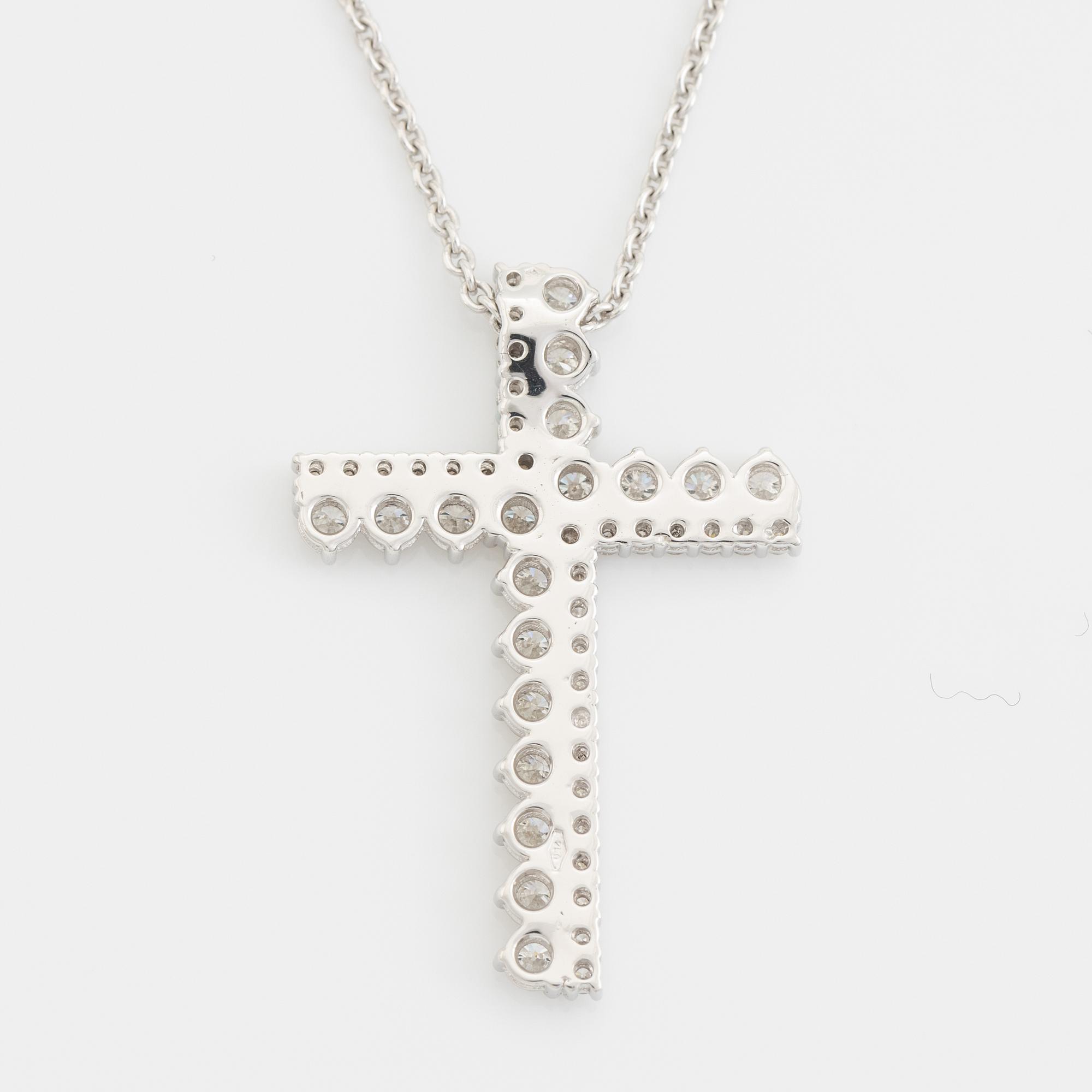 Brilliant cut diamond cross necklace.