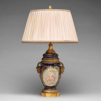 312. A French bronze mounted porcelain table lamp, late 19th Century, signed Thuilier.