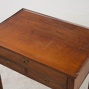 A late Gustavian mahogany writing table from araound the year 1800.