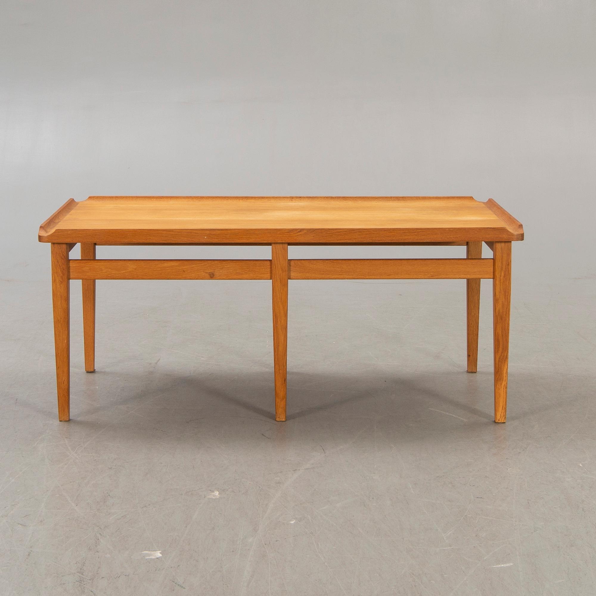A 1960s oak coffee table.