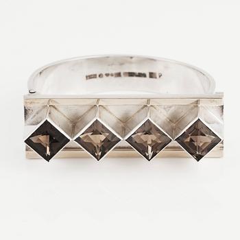 Sigurd Persson, a sterling silver, part gilt bangle with smoky qvartz (citrine), Stockholm 1963, executed by silversmith Peter Schmitt.