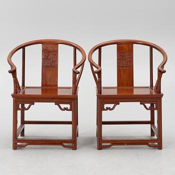 A pair of hardwood 'horse shoe back' hardwood armchairs, Hong Kong, 1960s.