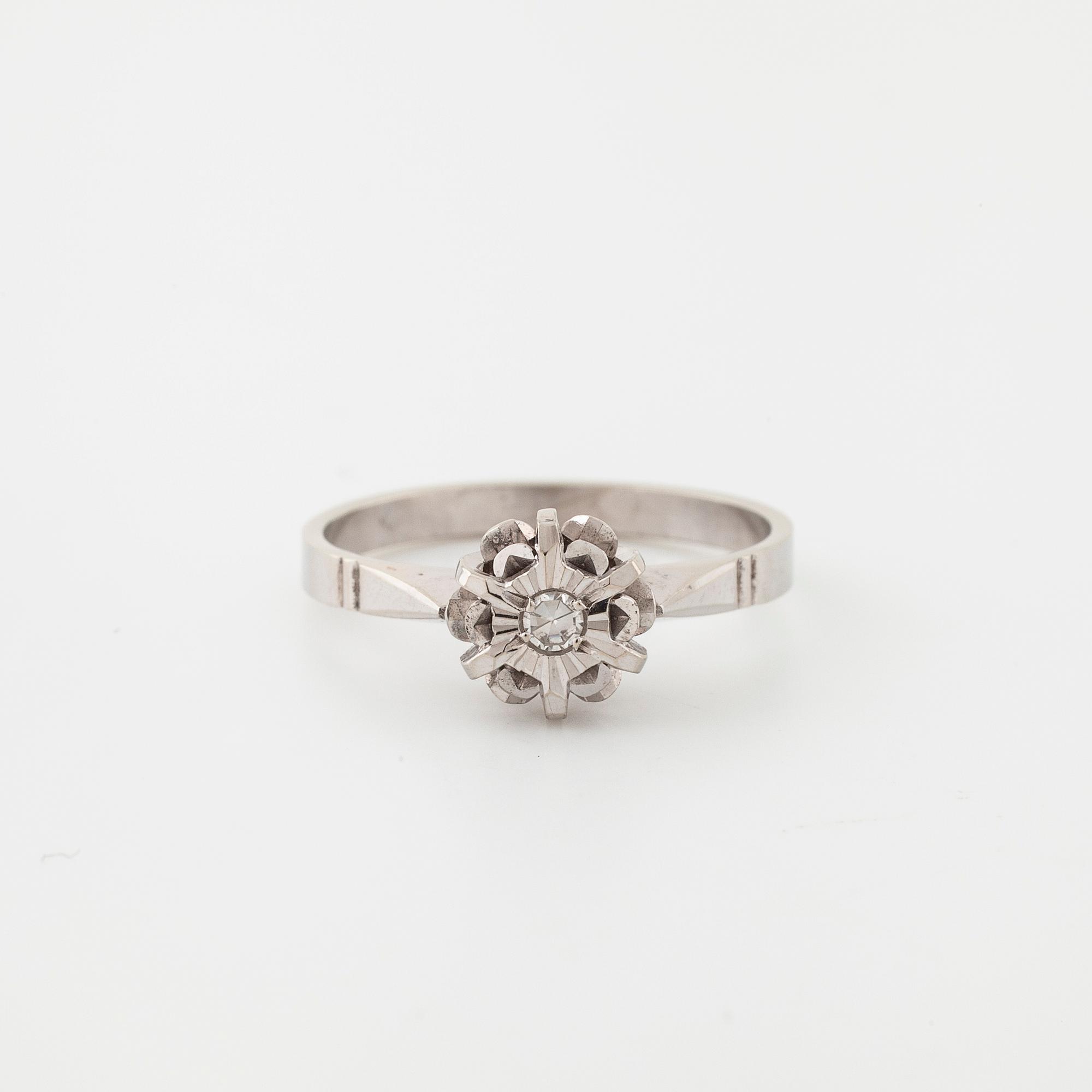 A single cut diamond ring.