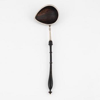 A silver mounted soup ladle with a coconut cup.