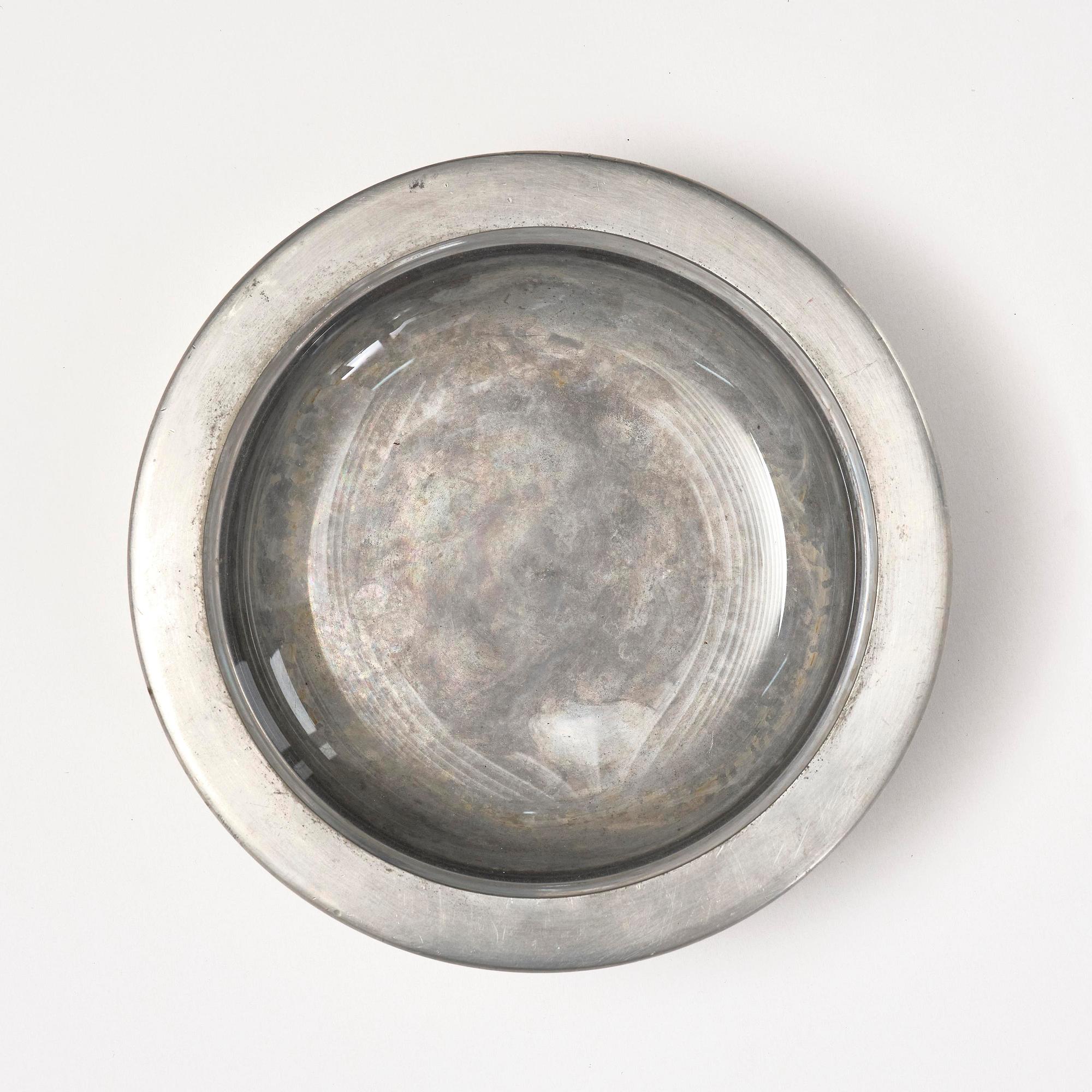 Firma Svenskt Tenn, a pewter and glass ashtray/bowl, Stockholm, 1950.