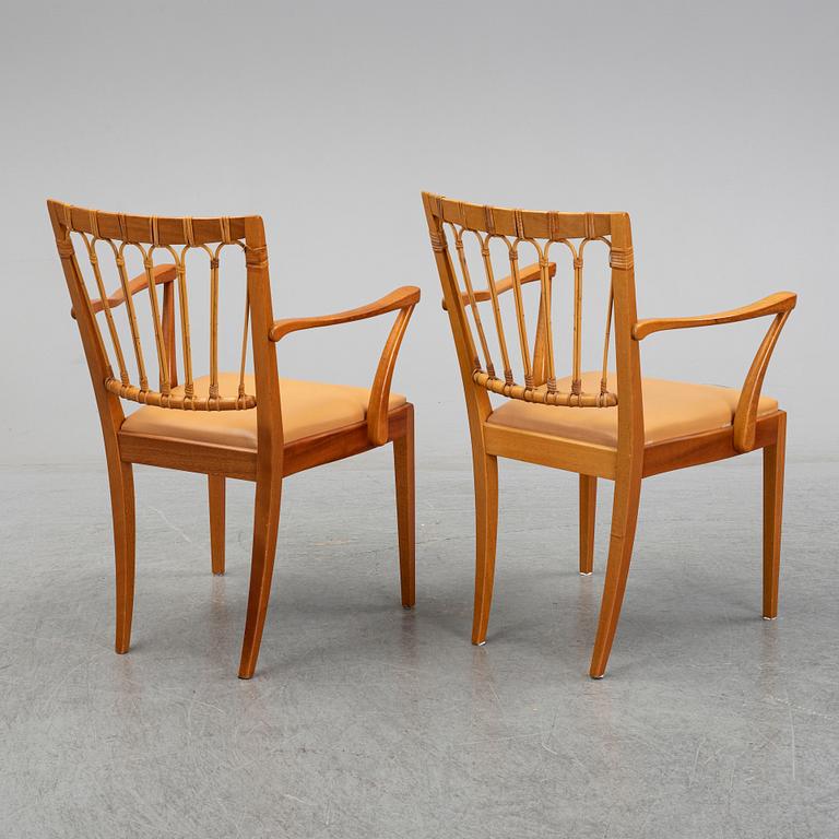 A pair of Josef Frank mahogany and rattan armchairs, Svenskt Tenn, Stockholm, Sweden.