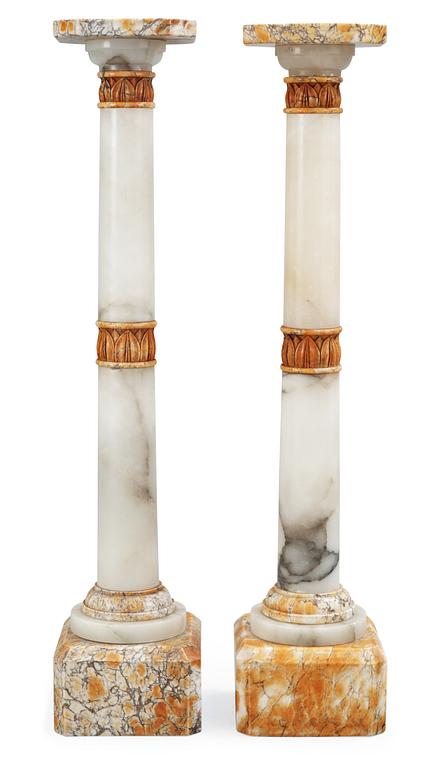 A pair of 20th century alabaster and marble pedestals.
