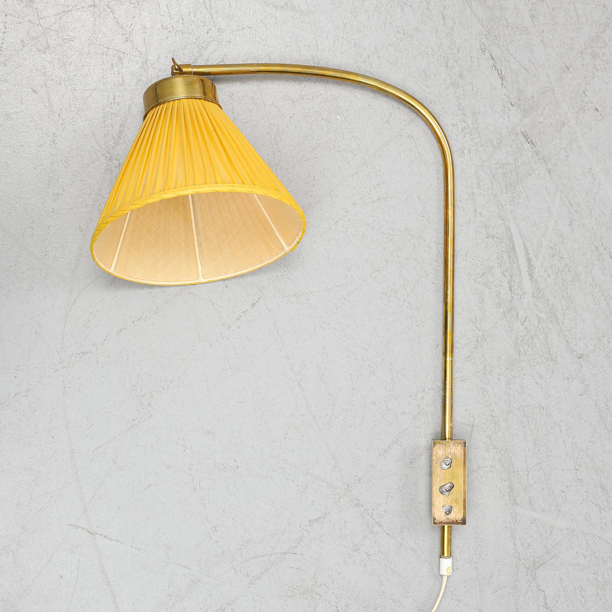 A model 2484 brass wall light by Josef Frank for Firma Svenskt Tenn.