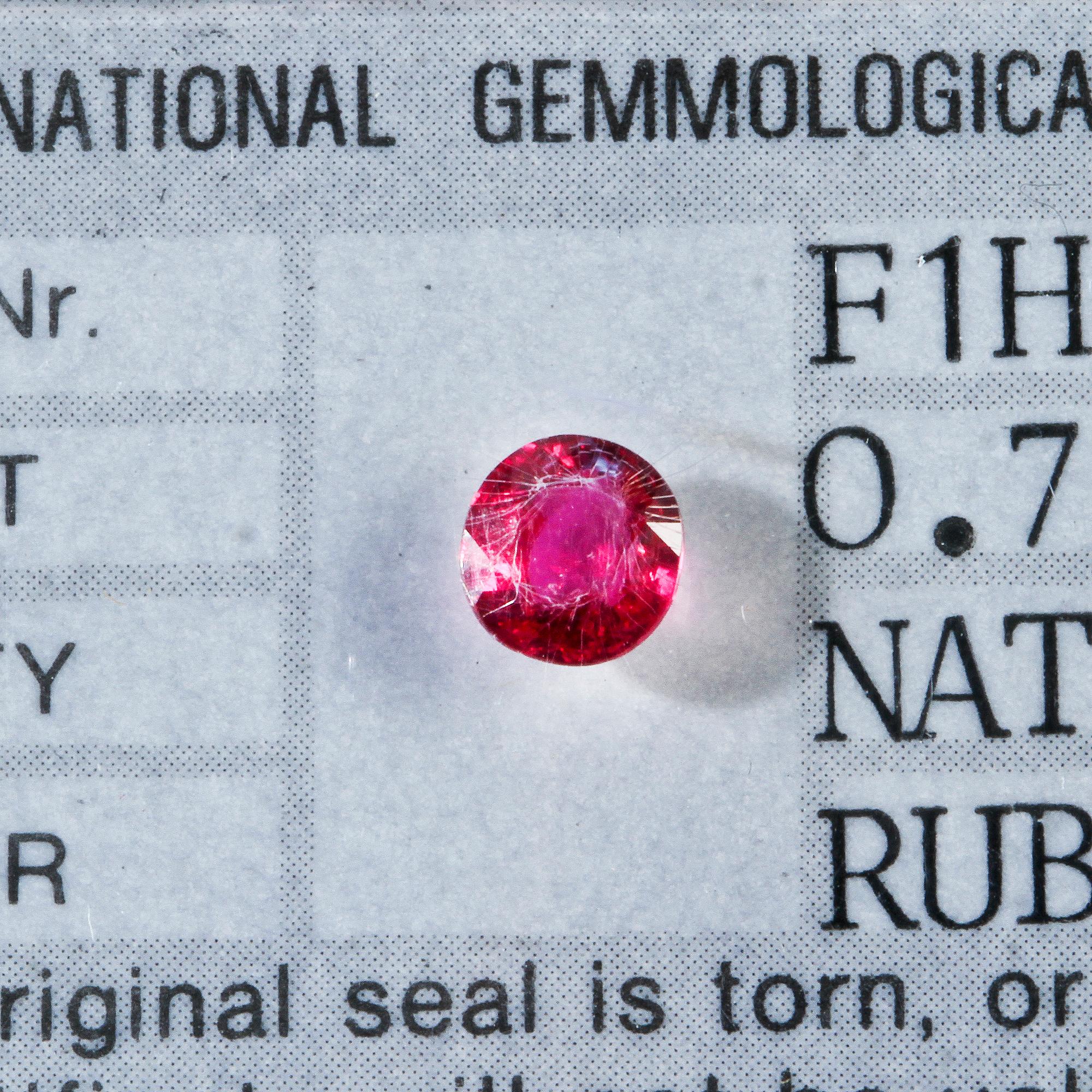 RUBINER, 2 st, fasettslipade, oinfattade, 0.45 ct resp 0.71 ct. Cert. IGI.