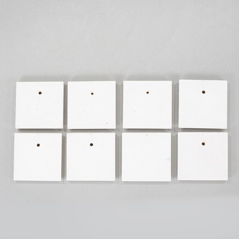nine wall plaques, signed.