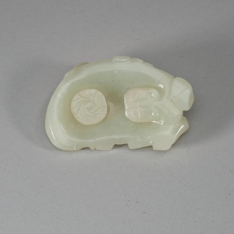 A carved white nephrite belt hook of a recumbent horse and a monkey, Qing dynasty (1644-1912).
