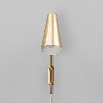 A wall light manufactured by Taito.