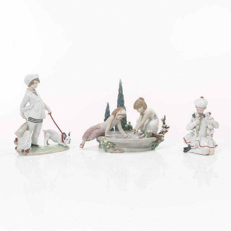 Lladró, three figurines,"Girl with French bulldog", "Girl with Dalmatians" and "Petals in the pond", Spain.
