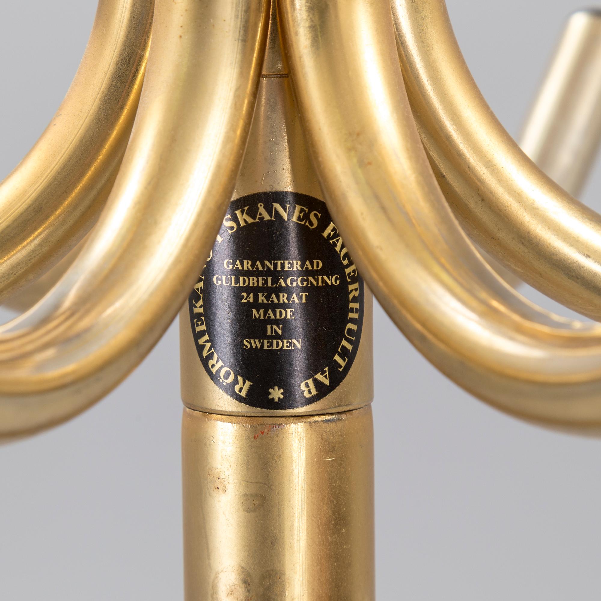 TAMBURMAJOR, guldpläterad metal, Rörmekano. Skånes Fagerhult, Sverige. 1970 / 80-tal.