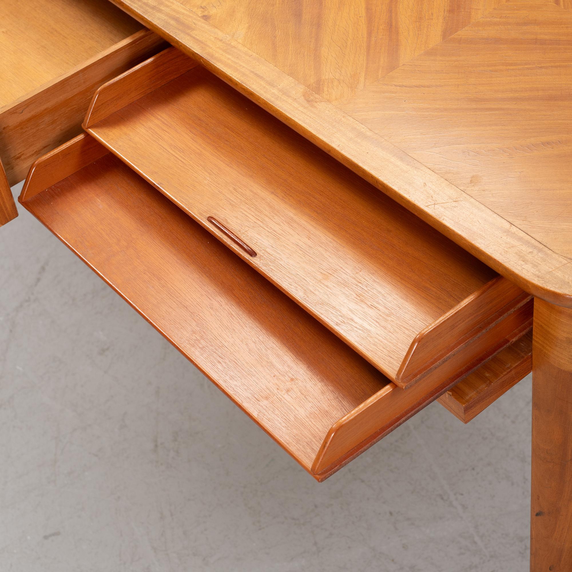 A mahogany veneered writing desk, 20th Century.