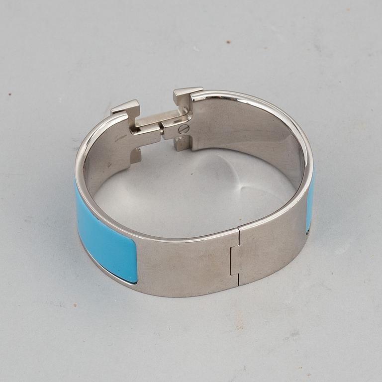 HERMÈS, a 'Clic H' bangle.