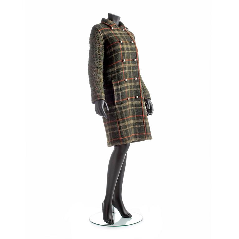 YVES SAINT LAURENT, a green wool blend coat.