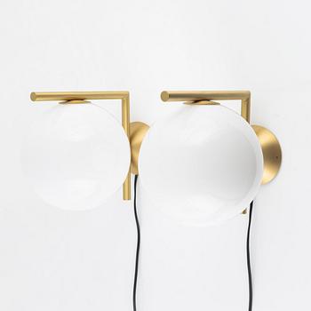 Michael Anastassiades, a pair of 'IC' brass wall lamps, Flos, Italy.