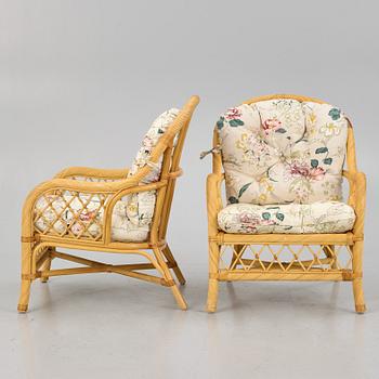 A rattan sofa and two armchairs, later part of the 20th century.
