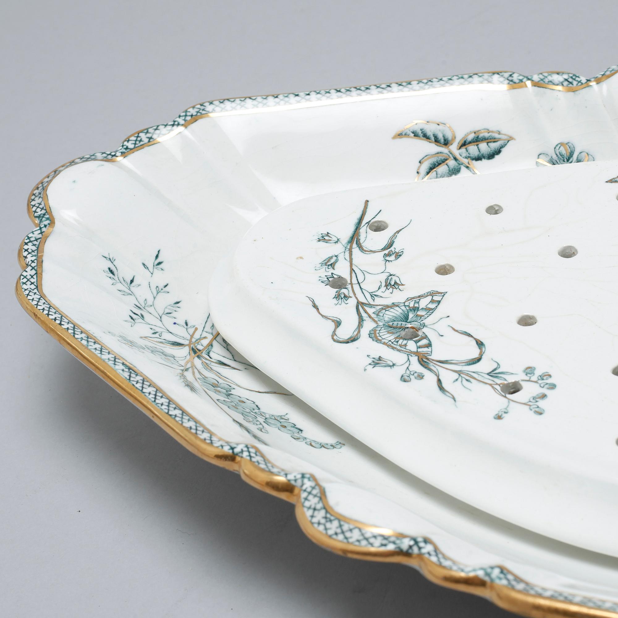 A earthenware table set of 136 pcs "Vexiö Guld",  by Arvid Ekberg, Gustafsberg, from around year 1900.