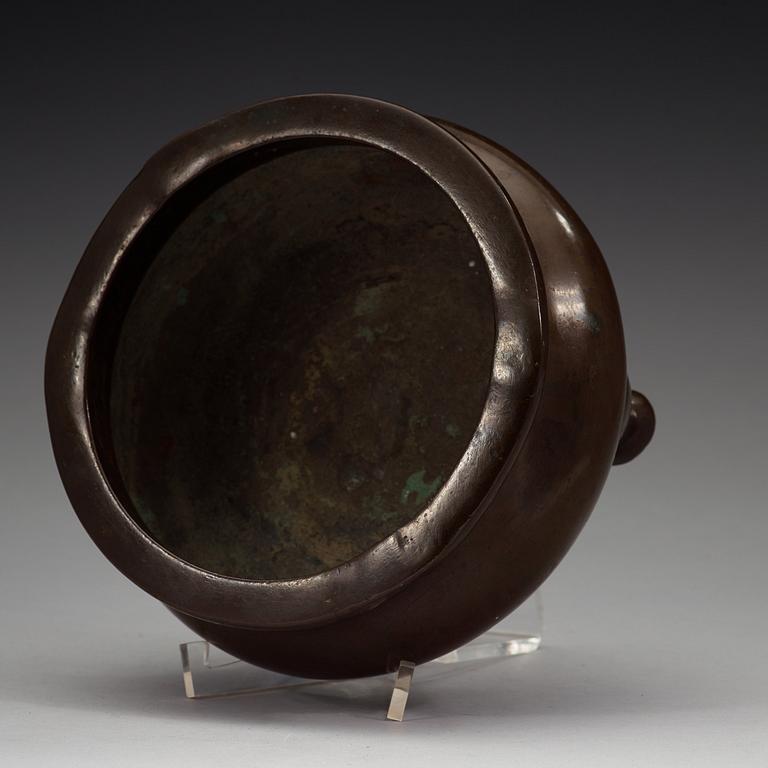 A bronze tripod censer, Ming dynasty (1368-1644).