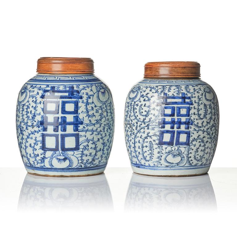 A pair of blue and white porcelain pots with covers, China, 19th century.