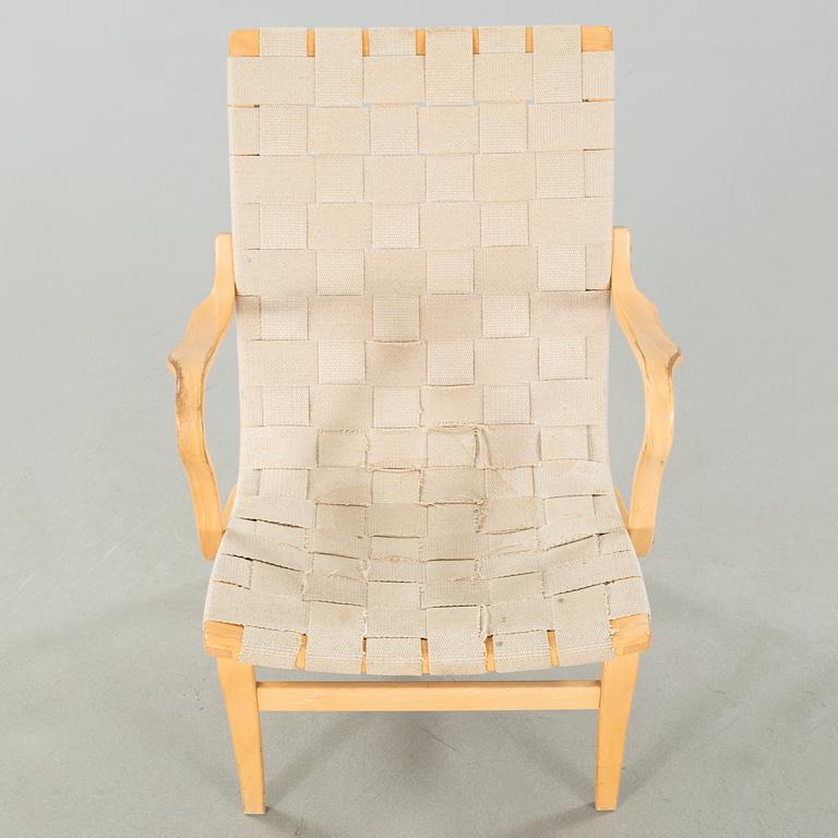 An "Eva" armchair, designed by Bruno Mathsson for Dux,