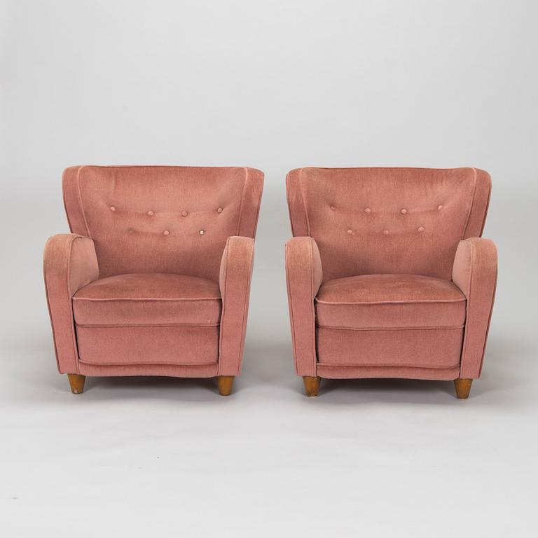 A pair of mid-20th century armchairs.