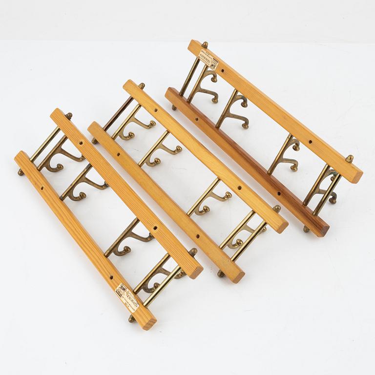A group of three 'Dekorativ' coat hangers, Skoglunds metallgjuteri, Anderstorp, 1950's/60's.