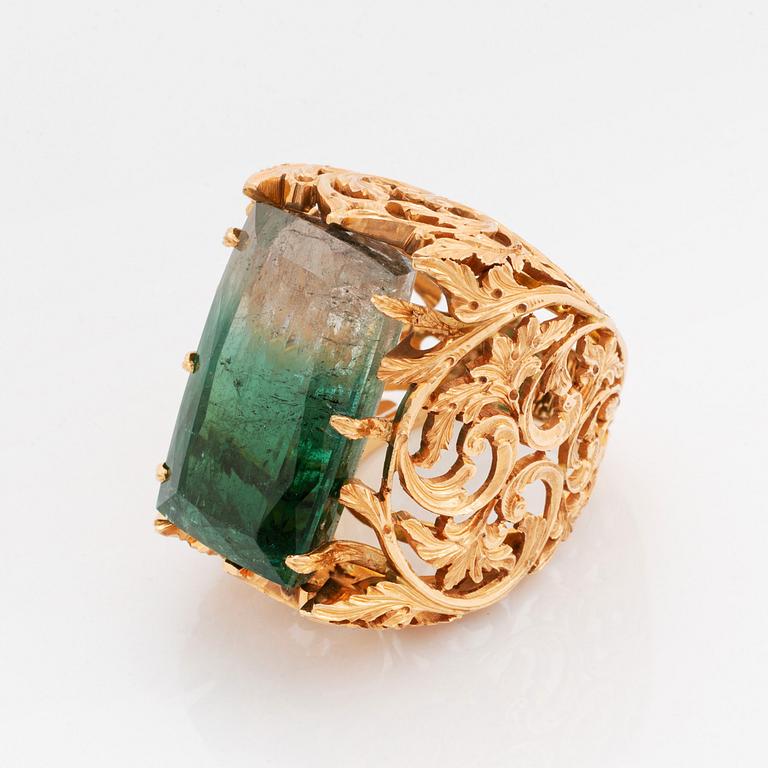 A Tina Karlsson ring in 18K gold set with a large step-cut tourmaline.