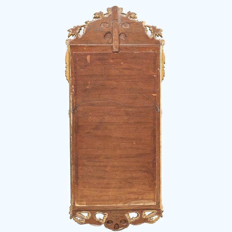 Rococo-style mirror dated 1919.