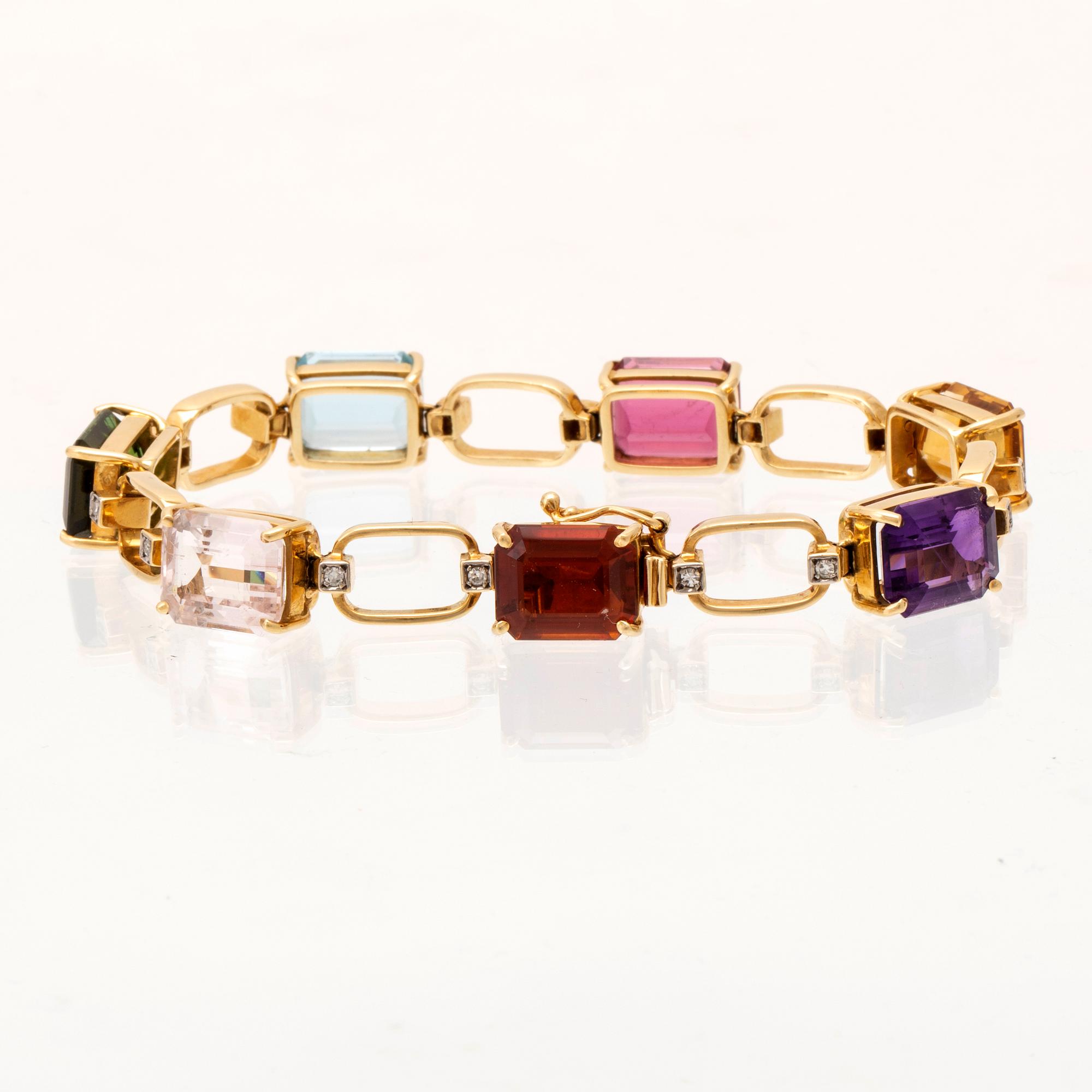 H Stern armband 18K guld och runda enkelslipade diamanter samt flertalet olika stenar.