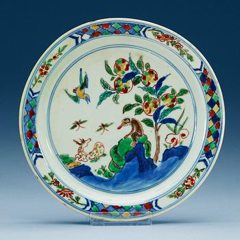 1743. A blue and white and wucai dish, Ming dynasty, Tianqi (1621-27).