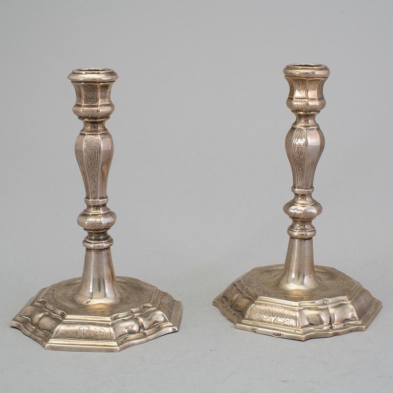 A pair of 18h century silver candlesticks, unidentified marks.