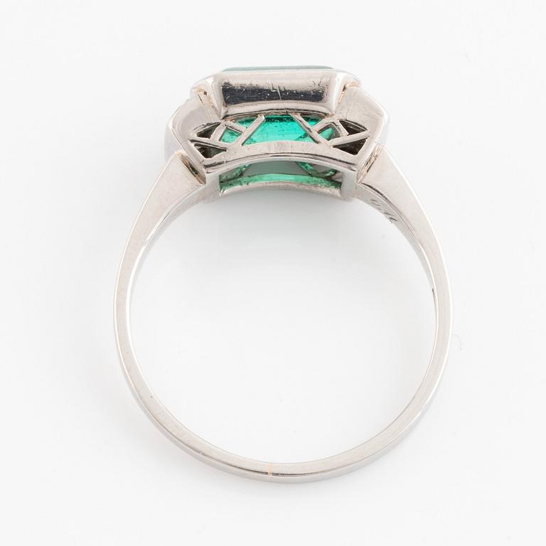 Platinum and emerald and eight cut diamond ring.