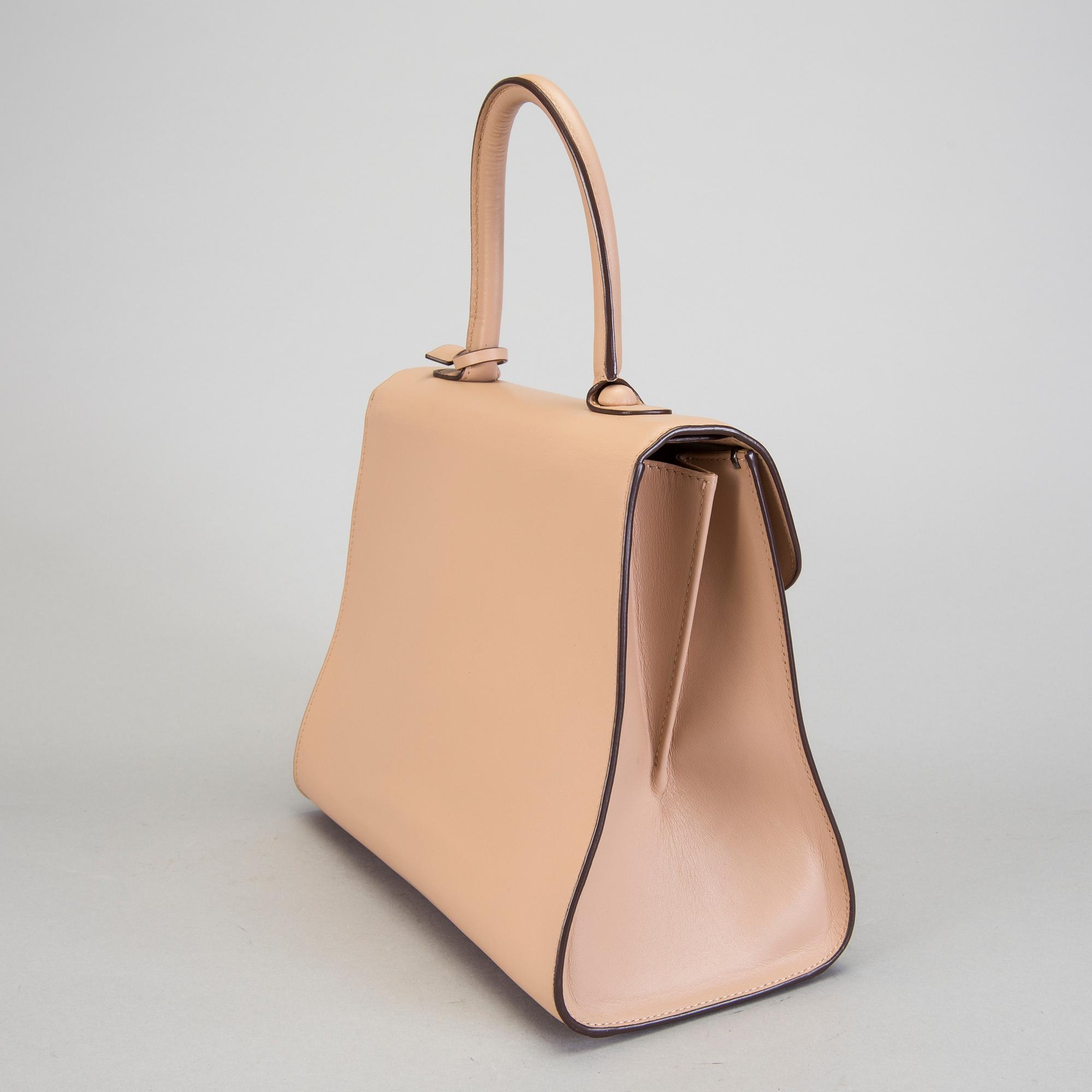 A Delvaux "Brillant" ladies handbag in nude/biscuit colored leather.
