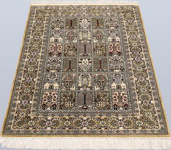 An Oriental silk rug, approx. 122 x 79 cm.