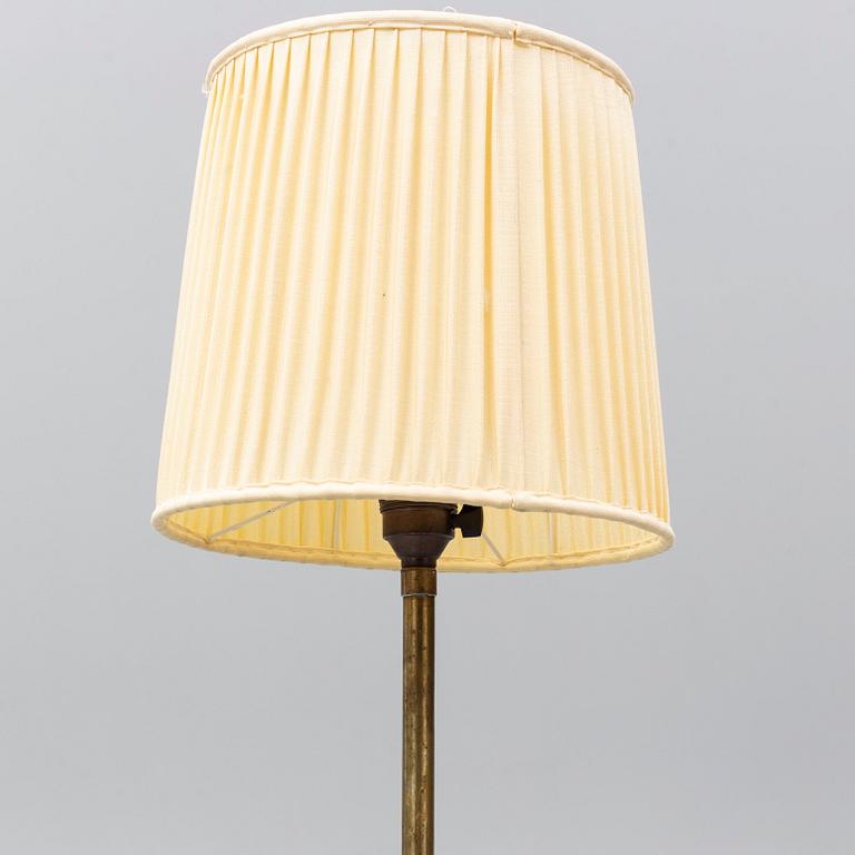 A 1940's brass floor lamp by Harald Elof Notini for Böhlmarks, Sweden 1940's, model 15390.