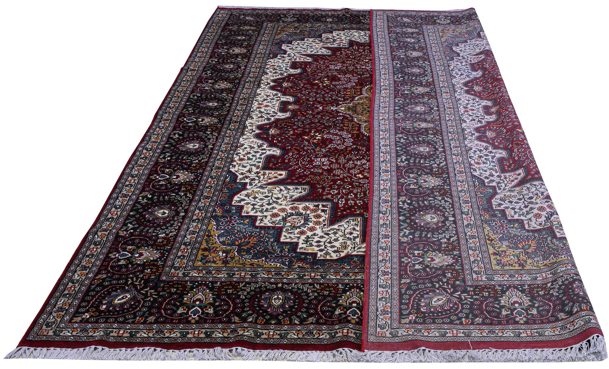 A carpet, Oriental Silk, ca 337 x 241 cm.
