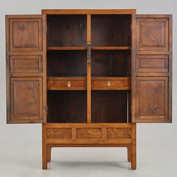 A huanghuali veneered, huamu and mixed wood cabinet, 19th century, Qing dynasty, 19th Century.