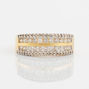 18K gold and small brilliant cut diamond ring.