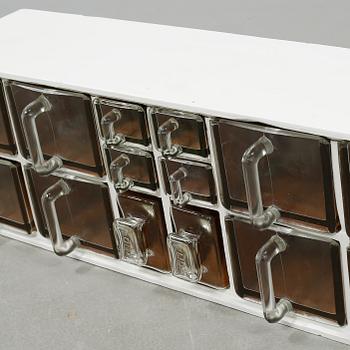 A spice rack from around the middle of the 20th century.