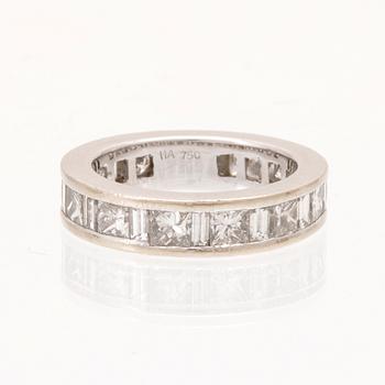An 18K white gold eternity ring set with baguette and princess cut diamonds by Hartmann's Denmark.