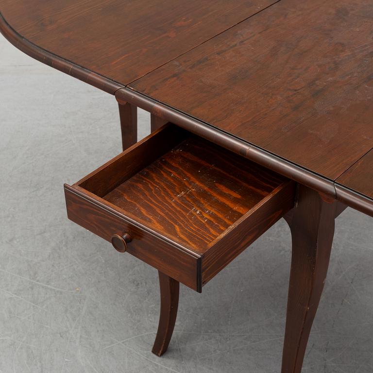 A stained pine gate-leg table, Åmells möbler.